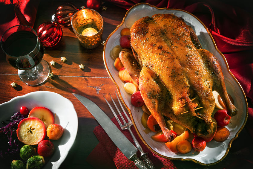 Roast Christmas duck with thyme and apples