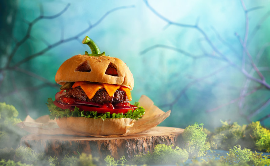 Halloween party burger in shape of scary pumpkin